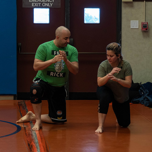 Instructor and student in combat class