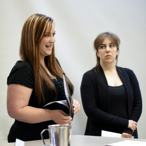 Two students presenting report to class