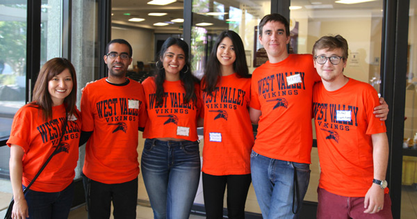 Group of students wearing orange West Valley shirts